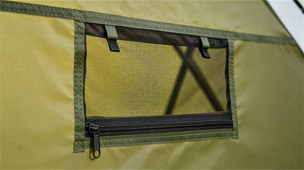 Tent fabric and window detail showing PVC coated polyester mesh screen and zipper