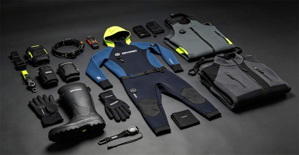 Complete dry suit accessories collection including neoprene hood, gloves, boots, and wrist seals arranged for cold water diving system. completing the dry suit system for comprehensive cold water protection