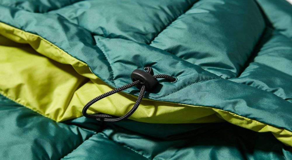 Close up of sleeping bag hood and drawstring detail head coverage design feature quality craftsmanship