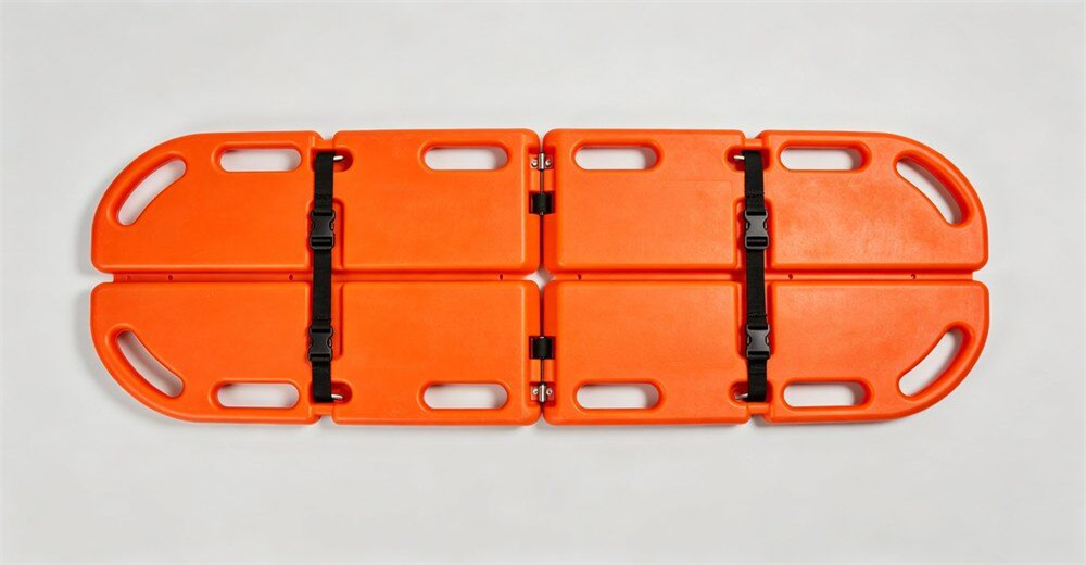 Wide angle shot of seven different types of water rescue stretchers arranged casually on bright outdoor training ground for product overview for wholesale bulk water rescue equipment supply