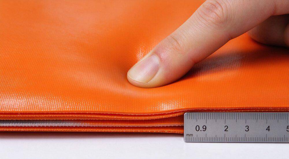 Close-up texture of durable reinforced PVC fabric used in every inflatable rescue boat showing woven surface flexible waterproof coating and multi-layer construction for long service life
