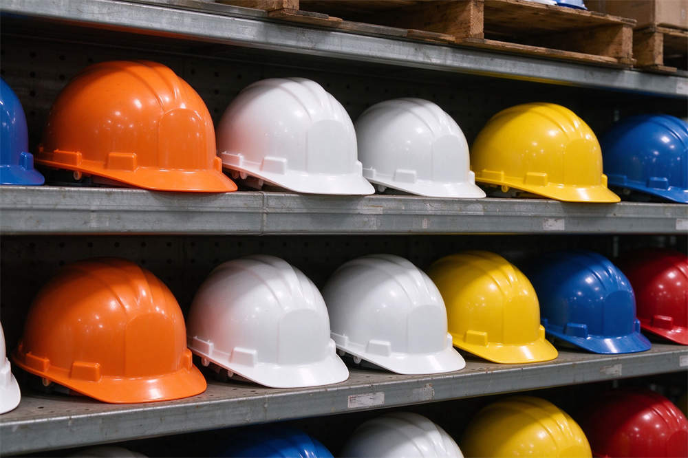 Safety helmets multiple colors on rack: orange white yellow blue red, water rescue PPE for emergency services