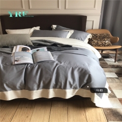 graue und weiße Bettwäsche-Sets